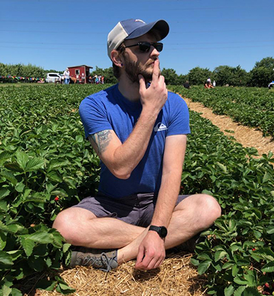 sitting in a trawberry field